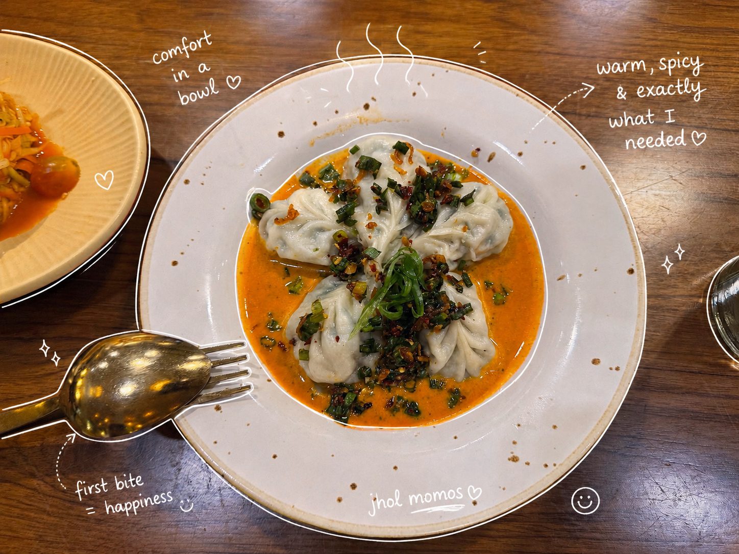 Steamed momos in spicy orange jhol broth with doodle notes
