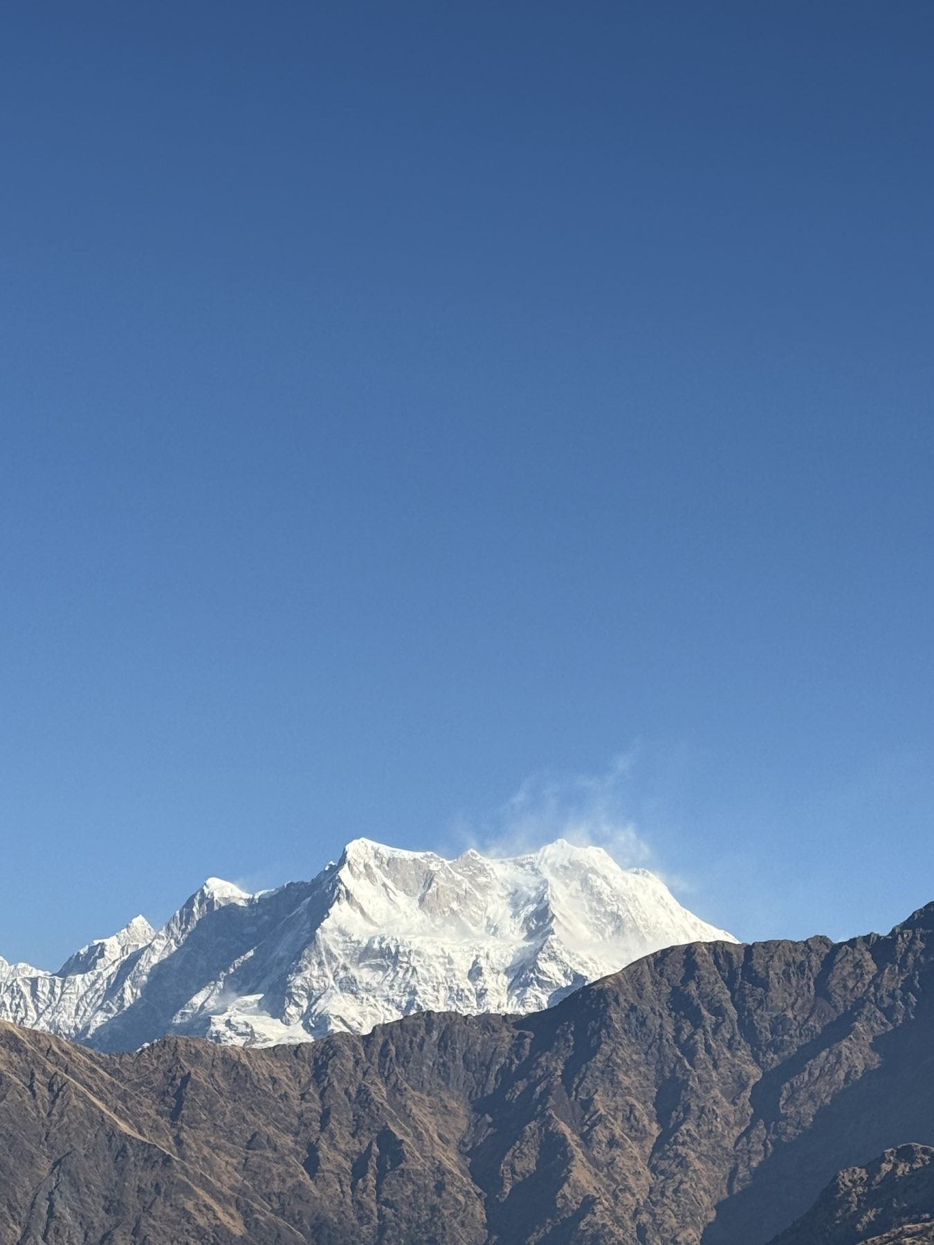Snow mountains under a clear blue sky
